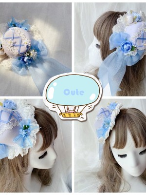 Blue mini top hat with feathers & fabric flowers – Larva